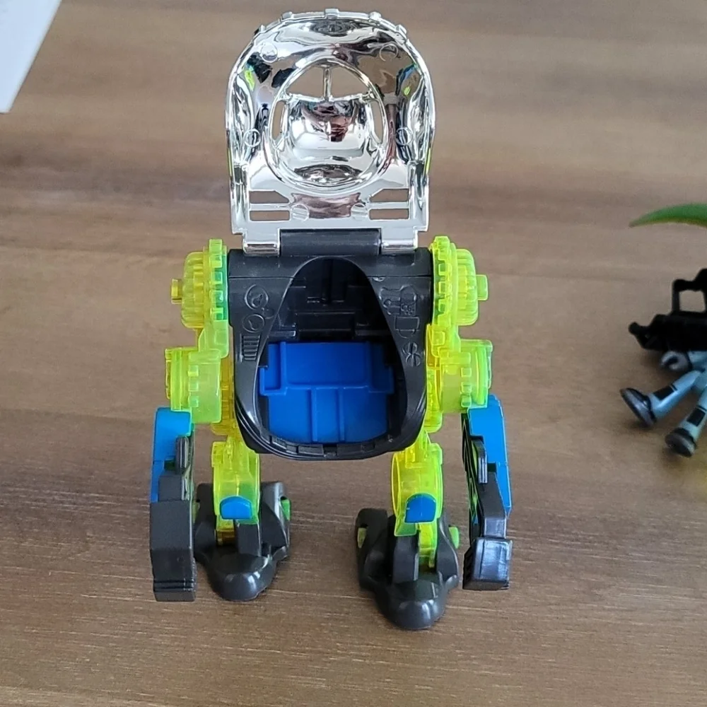 Fisher-Price Imaginext Raptor Doc & Exo Suit Dinosaur Figure Toy Set